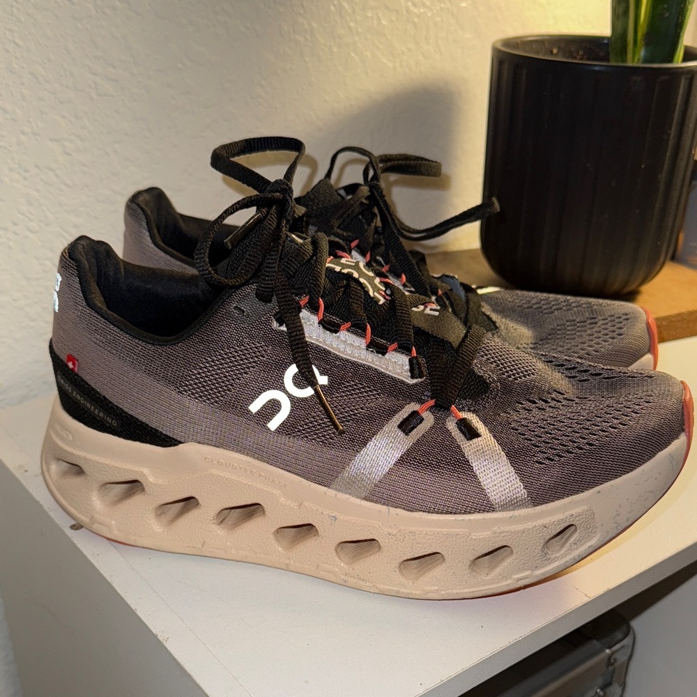 On Running Black and Gray Sneakers with Orange Accents